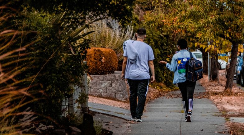 Two men walking down the street